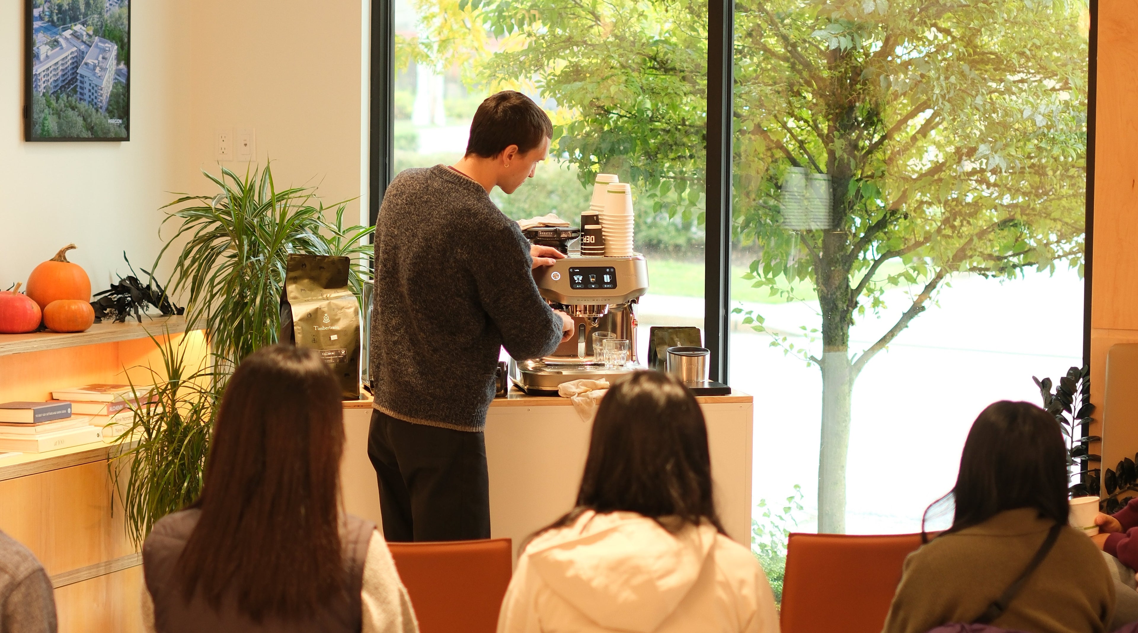 instructor using breville espresso machine